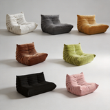 Set of colorful bean bag chairs on a plain background