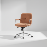 Ergonomic office chair side view showing adjustable height mechanism and contoured back support, tan fabric upholstery with black legs